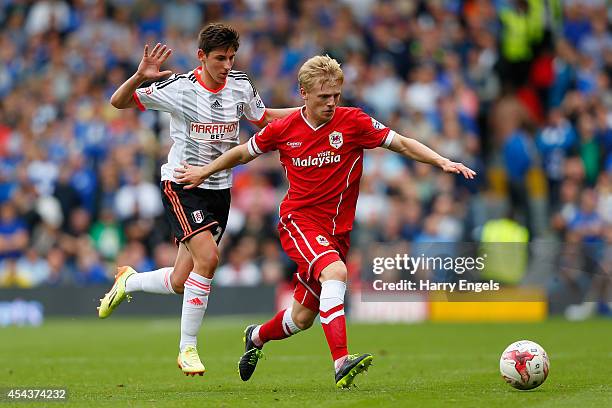 Mats Daehli of Cardiff City is challenged by Emerson Hyndman of Fulham during the Sky Bet Championship match between Fulham and Cardiff City at...