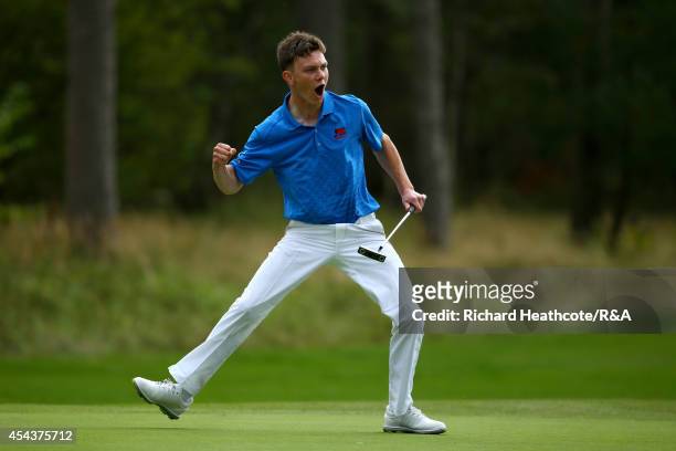 Rowan Lester of GB&I celebrates as he holes the putt that seals victory over Vitek Novak of Europe and secures the trophy for GB&I during the final...