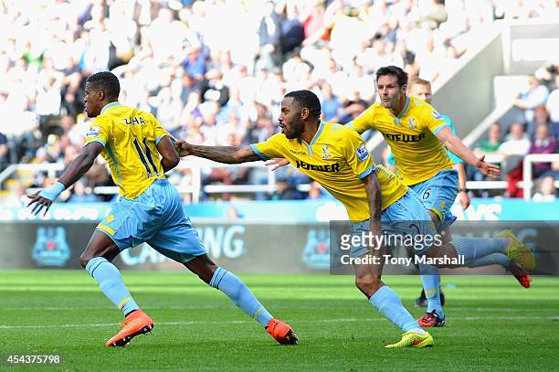 Wilfried Zaha of Crystal Palace celebrates scoring third goal with Jason Puncheon during the Barclays Premier League match between Newcastle United...