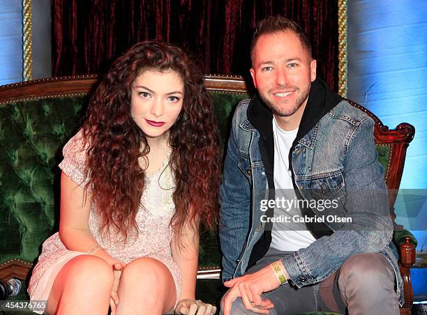 Singer Lorde poses with radio personality Ted Stryker backstage during The 24th Annual KROQ Almost Acoustic Christmas at The Shrine Auditorium on...