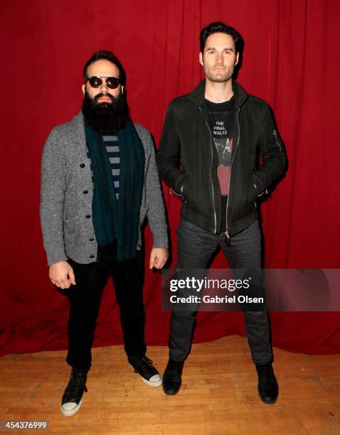 Musicians Sebu Simonian and Ryan Merchant of Capital Cities pose backstage during The 24th Annual KROQ Almost Acoustic Christmas at The Shrine...