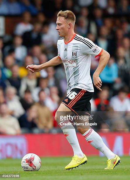 Cauley Woodrow of Fulham in action during the Sky Bet Championship match between Fulham and Cardiff City at Craven Cottage on August 30, 2014 in...