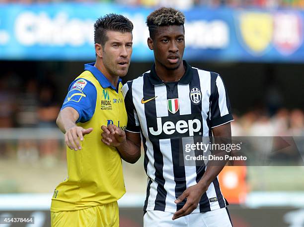 Kingsley Coman of Juventus and Mariano Julio Izco of Chievo Verona during the Serie A match between AC Chievo Verona and Juventus FC at Stadio...