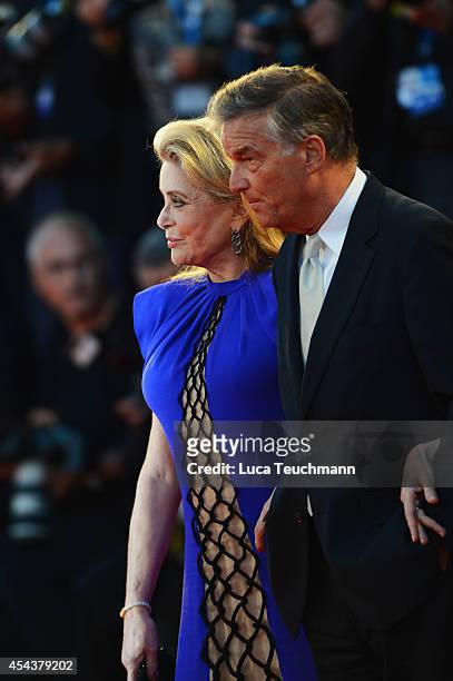 Catherine Deneuve and Benoit Jacquot attend the '3 Coeurs' premiere during the 71st Venice Film Festival on August 30, 2014 in Venice, Italy.