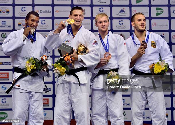 Under 100kg medallists L-R: Silver; Jose Armenteros of Cuba, Gold; Lukas Krpalek CZE of the Czech Republic, Bronzes; Ivan Remarenco of the United...