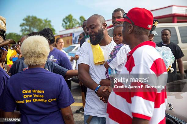 Michael Brown Sr. Greets supports at a rally for his son Michael Brown on August 30, 2014 in Ferguson, Missouri. Michael Brown, an 18-year-old...