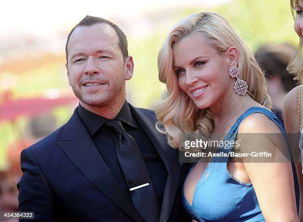 Actors Jenny McCarthy and Donnie Wahlberg arrive at the 2014 Creative Arts Emmy Awards at Nokia Theatre L.A. Live on August 16, 2014 in Los Angeles,...