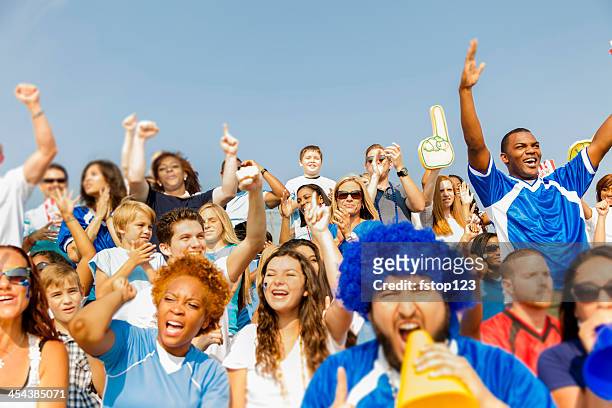 sports: fans cheer for their team during local sporting event. - crowd cheering stock pictures, royalty-free photos & images