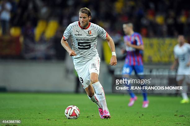 Rennes' Swedish forward Ola Toivonen runs with the ball during the French L1 football match between Caen and Stade Rennais on August 30 at the...