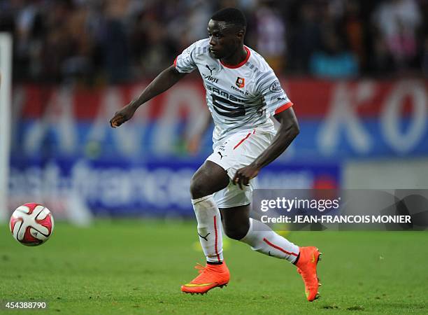 Rennes' French Cameroonian forward Paul-Georges Ntep runs with the ball during the French L1 football match between Caen and Stade Rennais on August...
