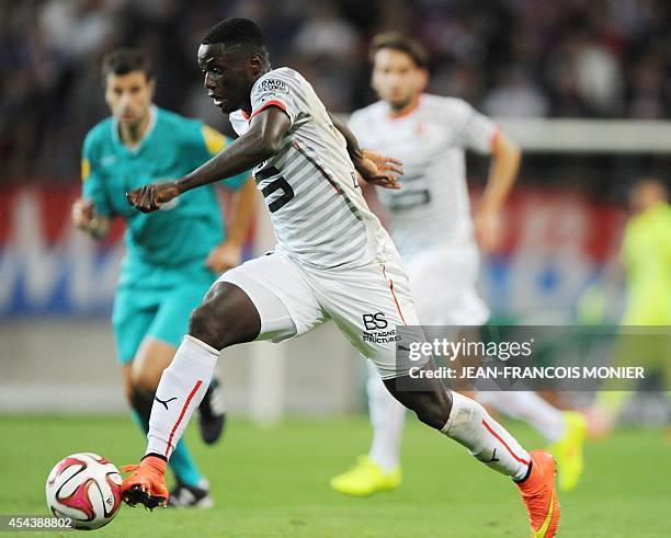 Rennes' French Cameroonian forward Paul-Georges Ntep runs with the ball during the French L1 football match between Caen and Stade Rennais on August...