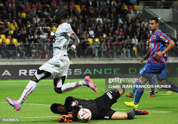 Rennes' French midfielder Abdoulaye Doucoure vies for the ball with Caen's French goalkeeper Remy Vercoutre during the French L1 football match...