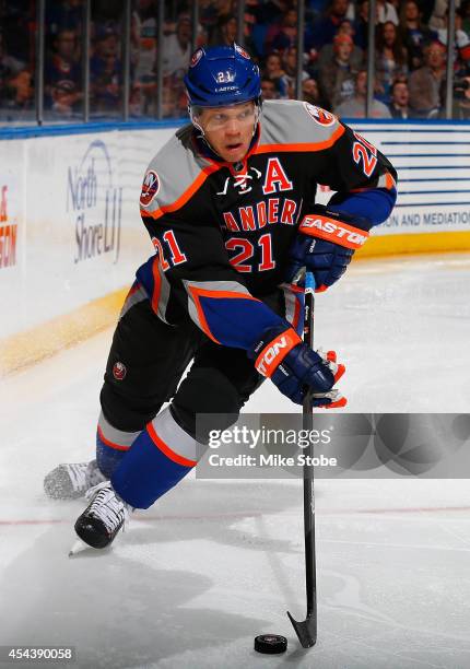 Kyle Okposo of the New York Islanders skates against the Anaheim Ducks at Nassau Veterans Memorial Coliseum on December 21, 2013 in Uniondale, New...