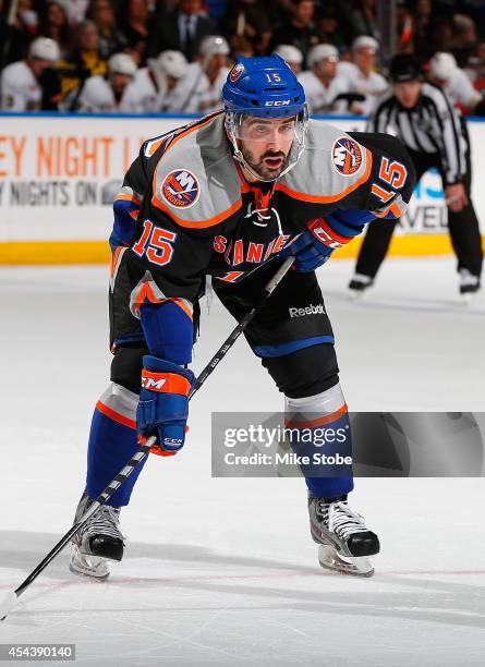 Cal Clutterbuck of the New York Islanders skates against the Anaheim Ducks at Nassau Veterans Memorial Coliseum on December 21, 2013 in Uniondale,...