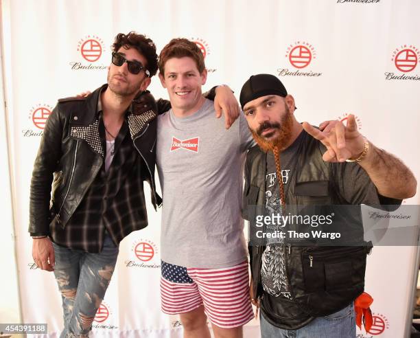Dave 1 of Chromeo, Vice President of Budsweiser Brian Perkins and P-Thugg of Chromeo pose backstage at the 2014 Budweiser Made In America Festival at...