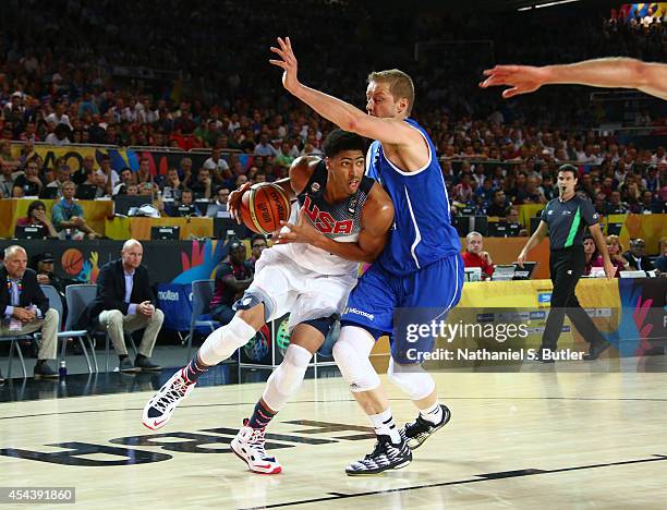 Anthony Davis of the USA Basketball Men's National Team drives against Hanno Möttölä of the Finland Basketball Men's National Team during the 2014...