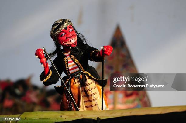 Wooden puppet show performs during Dieng Cultural Festival 2014 on August 30, 2014 in Dieng, Java, Indonesia. The Dieng Culture Festival is an annual...