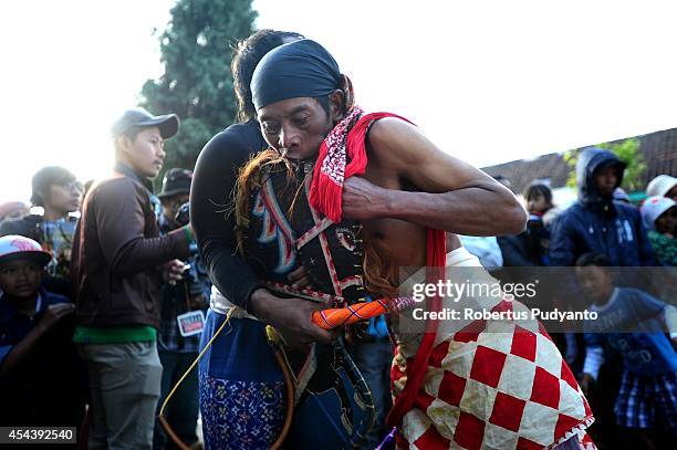 Traditional dancer goes into a trance while he performs during Dieng Cultural Festival 2014 on August 30, 2014 in Dieng, Java, Indonesia. The Dieng...