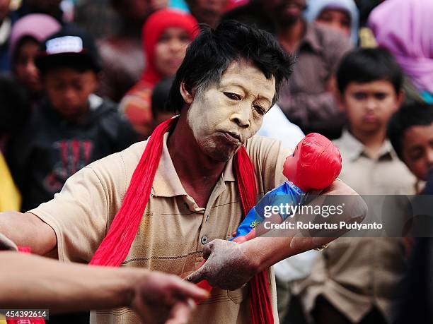 Traditional dancer performs during Dieng Cultural Festival 2014 on August 30, 2014 in Dieng, Java, Indonesia. The Dieng Culture Festival is an annual...