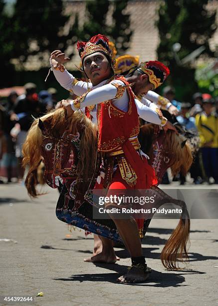 Traditional dancer performs during Dieng Cultural Festival 2014 on August 30, 2014 in Dieng, Java, Indonesia. The Dieng Culture Festival is an annual...