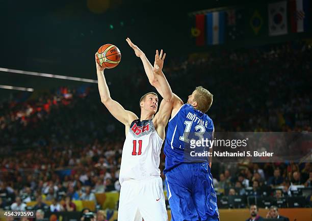 Mason Plumlee of the USA Basketball Men's National Team goes up against Hanno Möttölä of the Finland Basketball Men's National Team during the 2014...