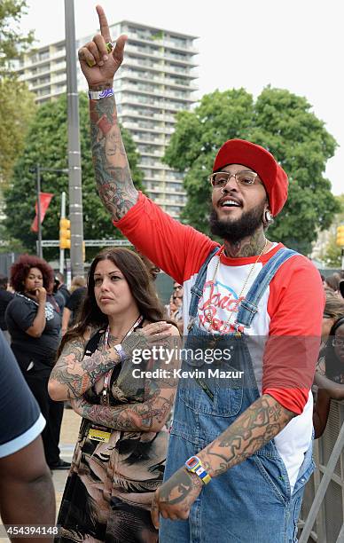 Mia Tyler and Travie McCoy attend the 2014 Budweiser Made In America Festival at Benjamin Franklin Parkway on August 30, 2014 in Philadelphia,...