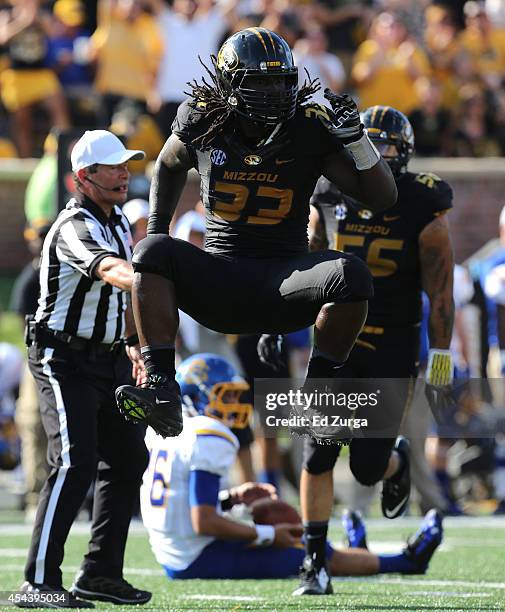 Markus Golden of the Missouri Tigers celebrates a sack on quarterback Zach Lujan of the South Dakota State Jackrabbits in the third quarter at...