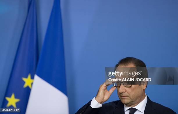 French president Francois Hollande, holds a press meeting, as part of a European Union summit on August 31, 2014 at the EU Headquarters in Brussels....