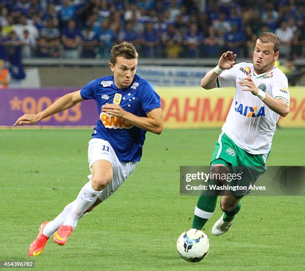 Dagoberto of Cruzeiro struggles for the ball with Rodrigo Biro of Chapecoense during a match between Cruzeiro and Chapecoense as part of Brasileirao...