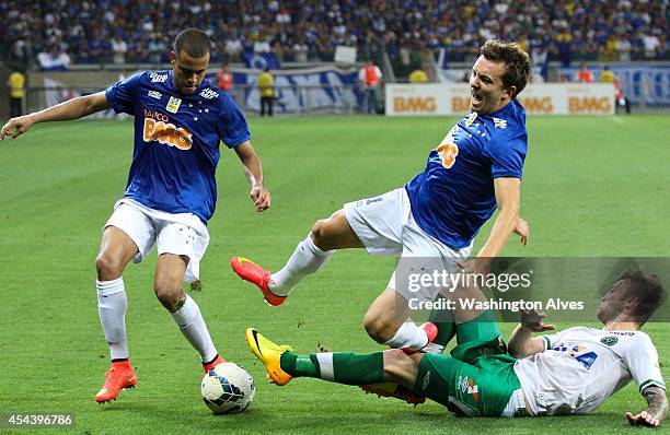 Dagoberto of Cruzeiro struggles for the ball with Rodrigo Biro of Chapecoense during a match between Cruzeiro and Chapecoense as part of Brasileirao...