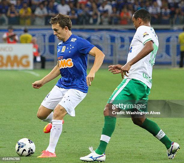 Dagoberto of Cruzeiro struggles for the ball with Ednei of Chapecoense during a match between Cruzeiro and Chapecoense as part of Brasileirao Series...