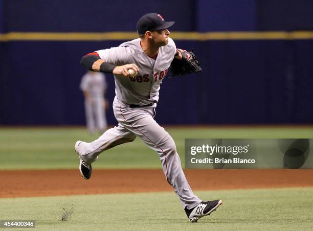 Third baseman Will Middlebrooks of the Boston Red Sox fields the single by Evan Longoria of the Tampa Bay Rays during the fifth inning of a game on...