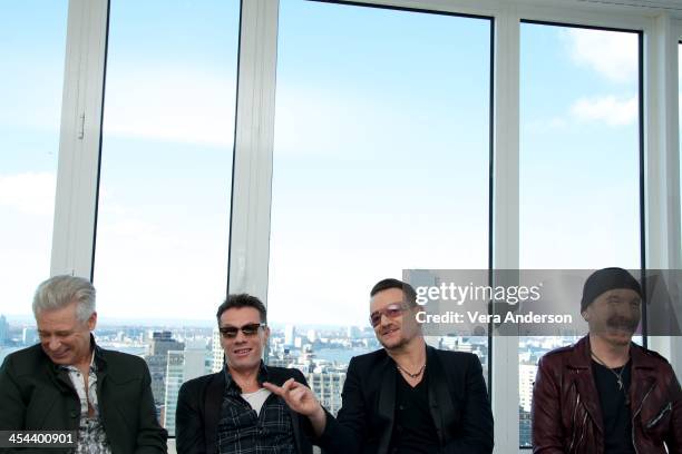 Adam Clayton, Larry Mullen, Jr., Bono and The Edge at the U2 Press Conference at the Mondrian Soho on December 7, 2013 in New York City.