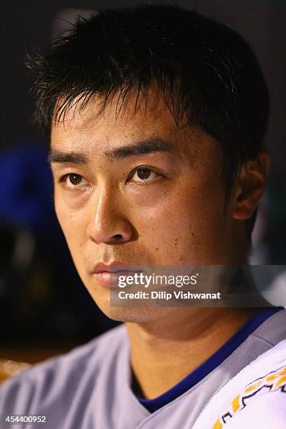 Starter Tsuyoshi Wada of the Chicago Cubs looks on from the dugout in the middle of the third inning against the St. Louis Cardinals at Busch Stadium...