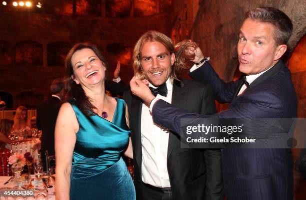 Susanne Ries, Star hairdresser Christian Sturmayr, Alfons Haider attend the Salzburg Festival Ball at Felsenreitschule on August 30, 2014 in...