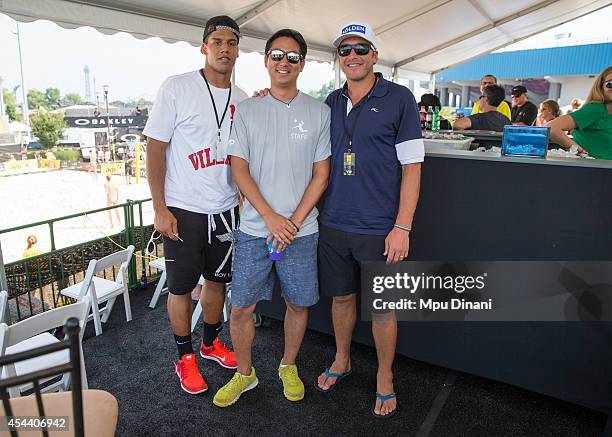 Managing Partner Donald Sun poses with Olympic Skier, Bode Miller , and Cincinnati Bengals defensive back, Taylor Mays , at the 2014 AVP Cincinnati...