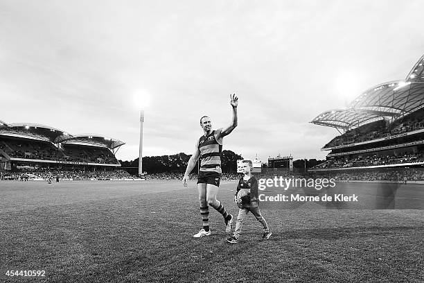 Ben Rutten of the Crows completes a lap after the round 23 AFL match between the Adelaide Crows and the St Kilda Saints at Adelaide Oval on August...