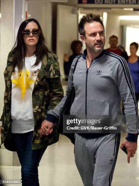 David Arquette and his girlfriend Christina McLarty are seen arriving at LAX airport on December 08, 2013 in Los Angeles, California.