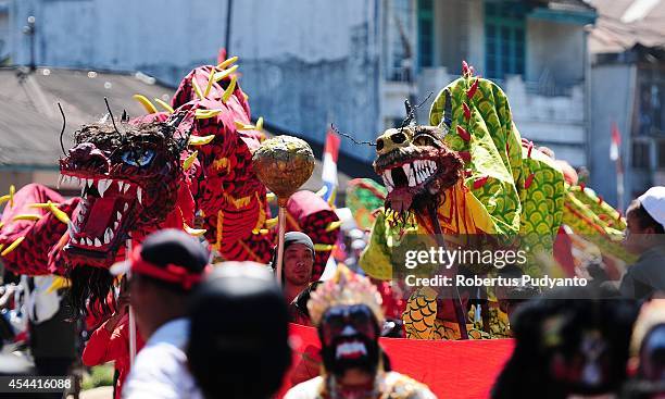 Chinese traditional art performs during Ruwatan Rambut Gimbal parade on August 31, 2014 in Dieng, Java, Indonesia. The Dieng Culture Festival is an...