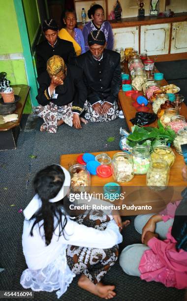 Dieng's religious leader prepare the Ruwatan Rambut Gimbal ceremony on August 31, 2014 in Dieng, Java, Indonesia. The Dieng Culture Festival is an...