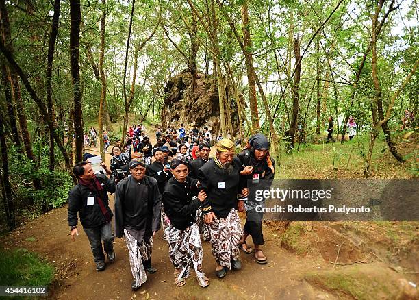 Dieng's religious leaders attend to the Larung ritual as part of Ruwatan Rambut Gimbal ceremony on August 31, 2014 in Dieng, Java, Indonesia. The...