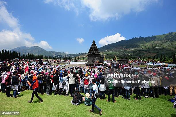 Revellers gather to see the Ruwatan Rambut Gimbal ceremony as part of Dieng Cultural Festival 2014 on August 31, 2014 in Dieng, Java, Indonesia. The...