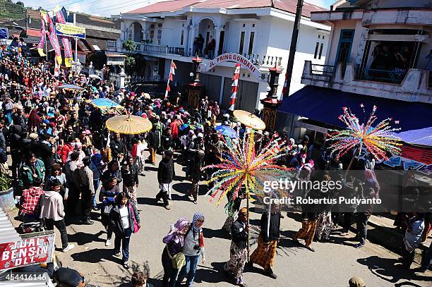 Dieng's dreadlock kids are paraded for the Ruwatan Rambut Gimbal ceremony on August 31, 2014 in Dieng, Java, Indonesia. The Dieng Culture Festival is...