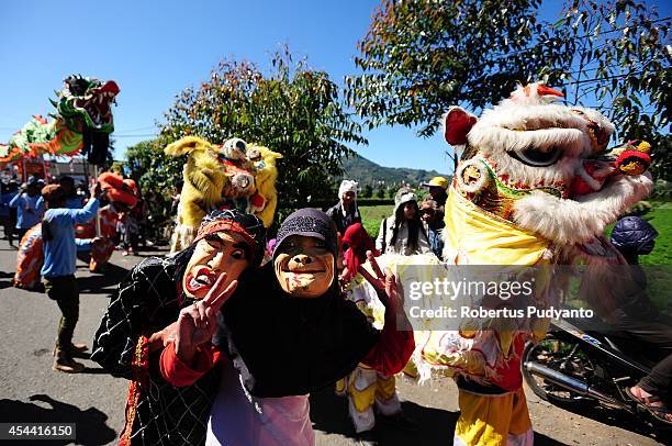 Chinese traditional art performs during Ruwatan Rambut Gimbal parade on August 31, 2014 in Dieng, Java, Indonesia. The Dieng Culture Festival is an...