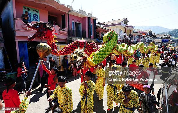 Chinese traditional art performs during Ruwatan Rambut Gimbal parade on August 31, 2014 in Dieng, Java, Indonesia. The Dieng Culture Festival is an...