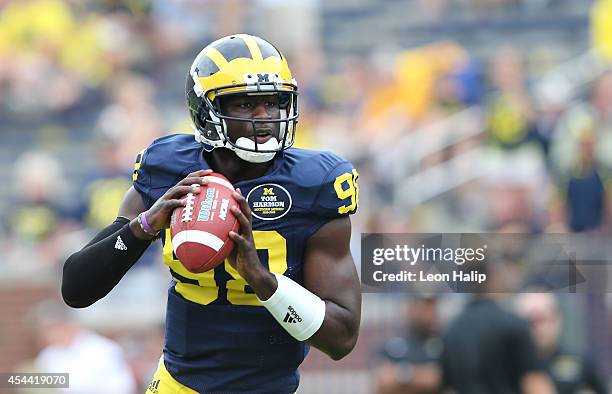 Quarterback Devin Gardner of the Michigan Wolverines warms up prior to the start of the game against the Appalachian State Mountaineers on August 30,...