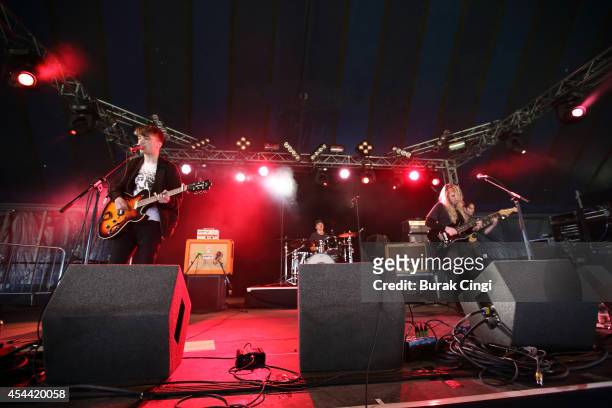 Thom Southern and Lucy Southern of Southern perform on stage at Reading Festival at Richfield Avenue on August 22, 2014 in Reading, United Kingdom.