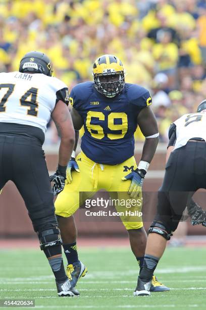 Willie Henry of the Michigan Wolverines looks for the ball carrier during the second half of the game against the Appalachian State Mountaineers on...
