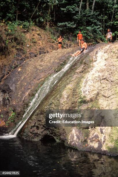 Western Samoa, Island Of Upolu Children Playing At Sliding Rock, Near Apia.