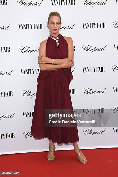 Uma Thurman attends the Chopard And Vanity Fair Present 'Backstage At Cinecitta' Exhibition - Red Carpet - 71st Venice Film Festival at Cipriani...